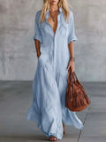 Light blue button-front maxi shirt dress with rolled sleeves and pockets shown in a front styled view